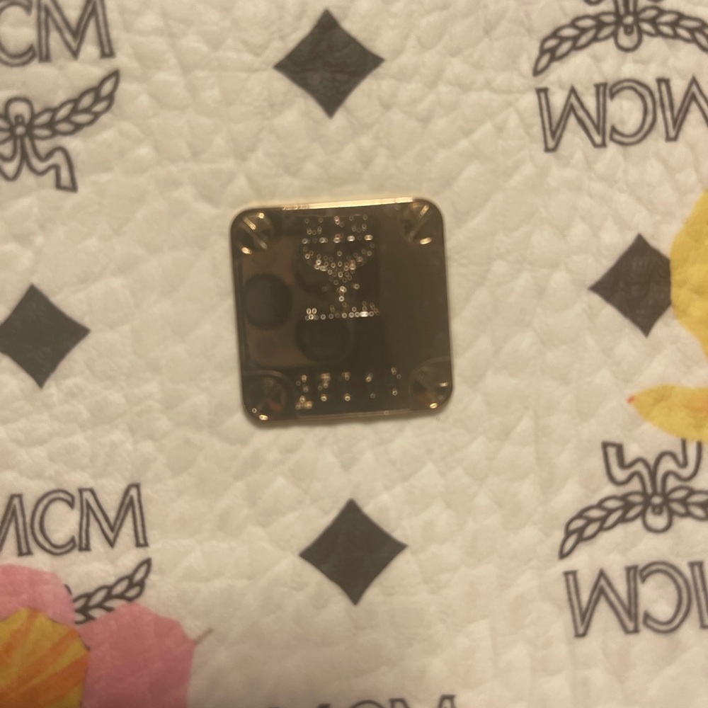 MCM top zipper tote with make up bag. Never used